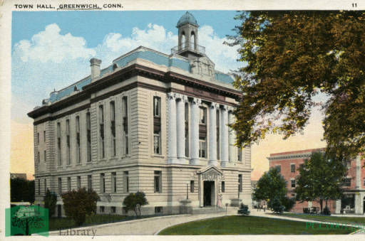 A historic postcard showing the old Town Hall that burned in a fire.