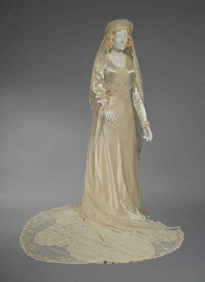Wedding Dress Worn by Lydia Ferris Lester:
American
1938
Synthetic, cotton, metal closures
Estate of Lydia Ferris Lester, museum purchase with funds from Mr. and Mrs. Hugh B. Vanderbilt